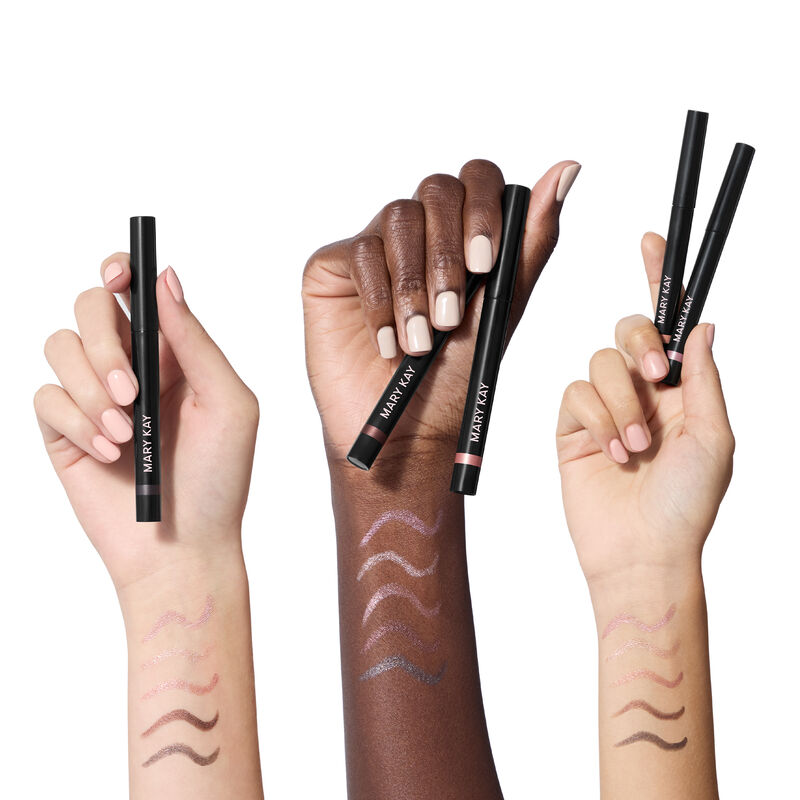 Three wrists in light, deep and medium skin tones display swatches of all five Mary Kay Shimmer Eye Shadow Sticks, highlighting color payoff.