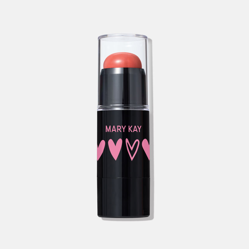 Der Mary Kay Blush Stick im Farbton Kind Spirit: Korallenroter Cremerouge-Stift in einer eleganten schwarzen H&uuml;lse mit rosa Herzmotiven und Kappe