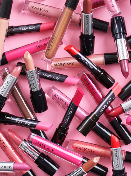 Variety of Mary Kay lip products spread out
